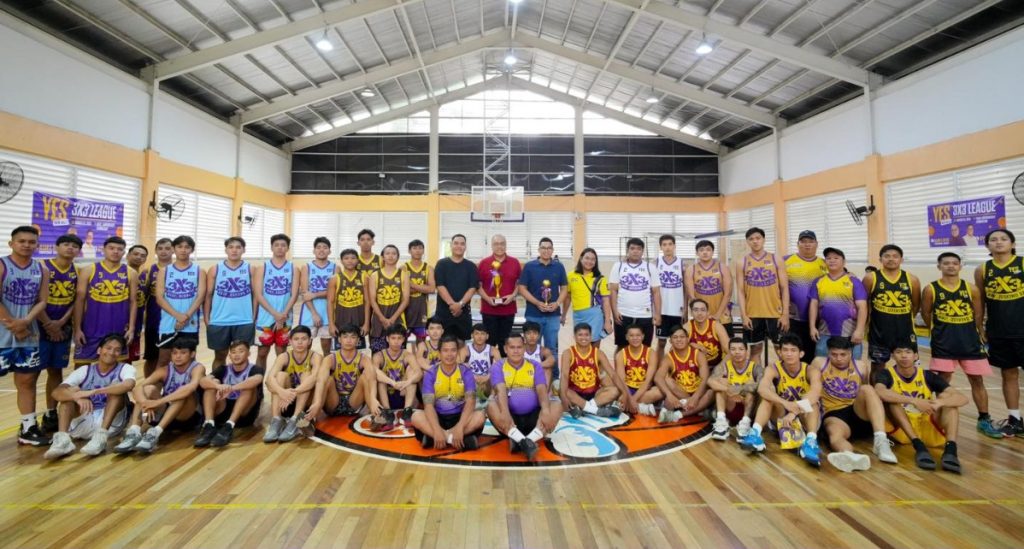 Congressman Allan Reyes with local players at a 3x3 basketball tournament in Quezon City, promoting sports and community engagement. Yes Na All!